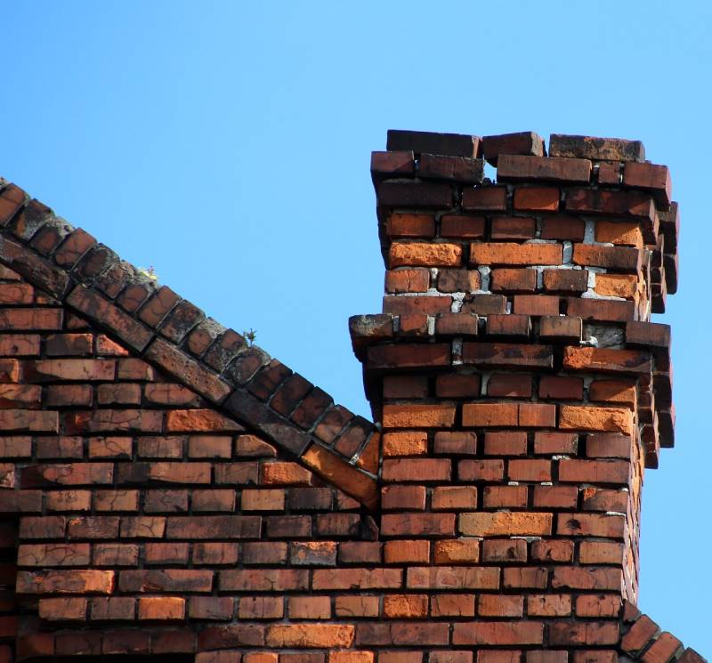 Signs Your Prosper Home Needs a Chimney Inspection Damaged chimney on an Prosper home showing cracks and missing mortar